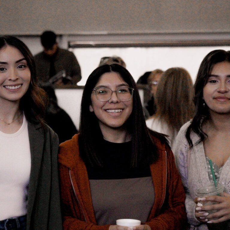 Members of La Viña greeting one another before the service