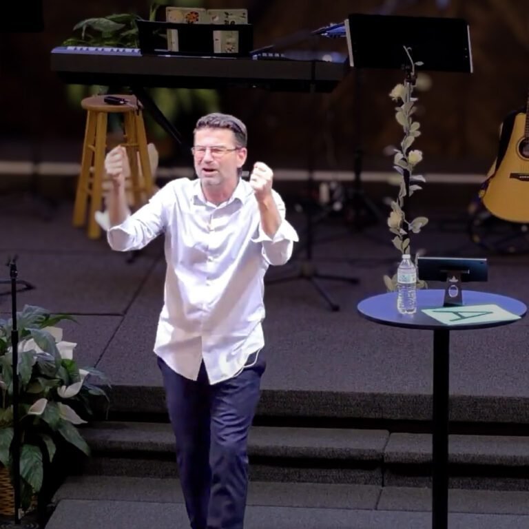 Pastor preaching during a Sunday service at La Viña